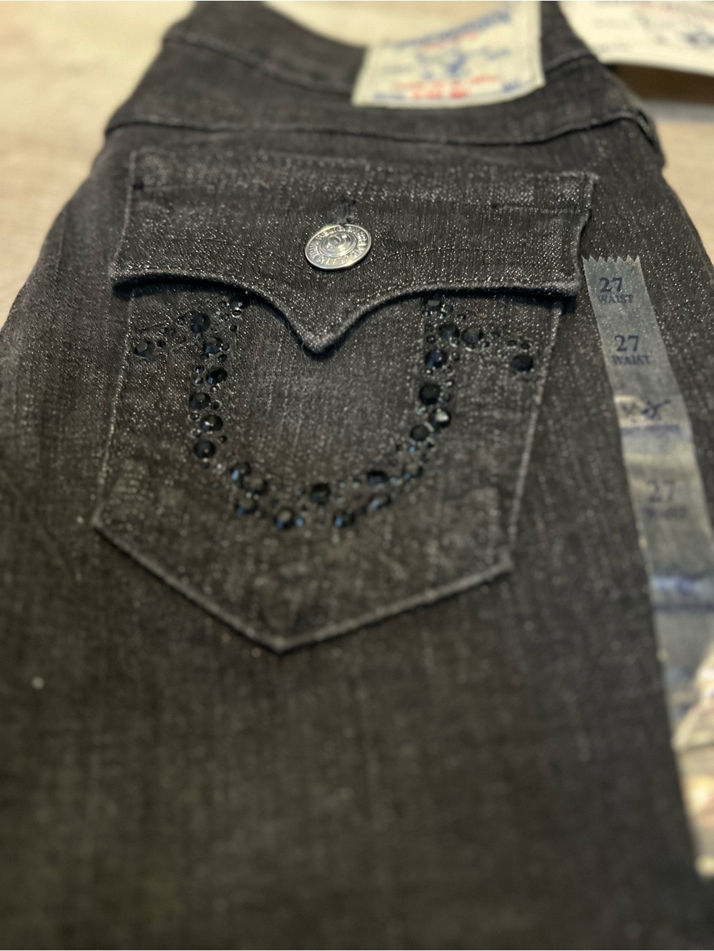 True Religion High Rise Jeans in Charcoal Black with Embellished Pocket. Size 27